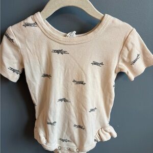 Kate Quinn short sleeve ruffle leg bodysuit in black airplanes